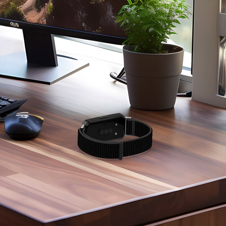 Black nylon watch band fitted to a fitness tracker, shown from the back