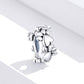 Heart-shaped sterling silver charm bead with dangling round bead details