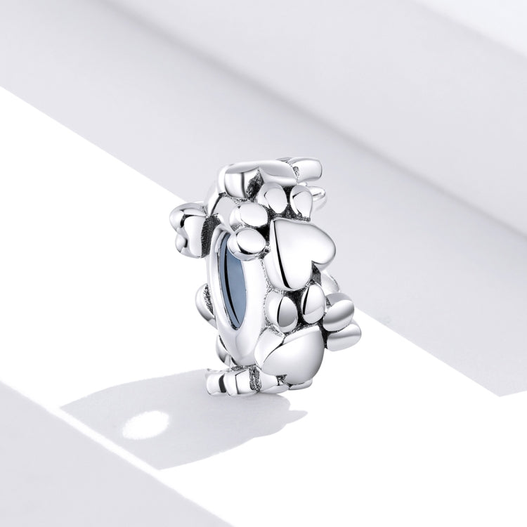 Heart-shaped sterling silver charm bead with dangling round bead details