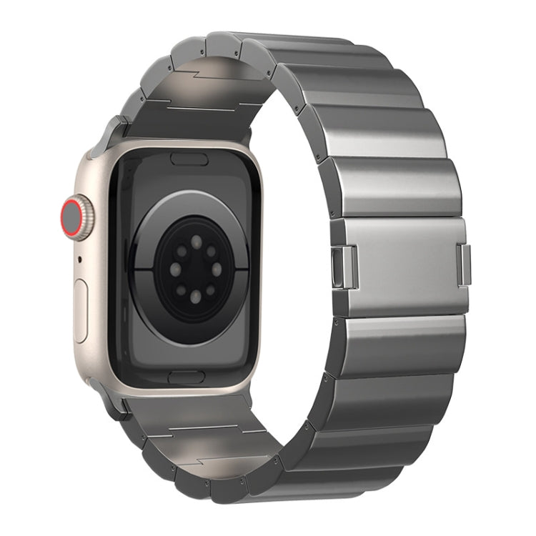Gray titanium metal watch band with magnetic buckle, shown on a smartwatch
