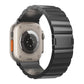 Black metal watch band with magnetic buckle, shown on the back of a smartwatch