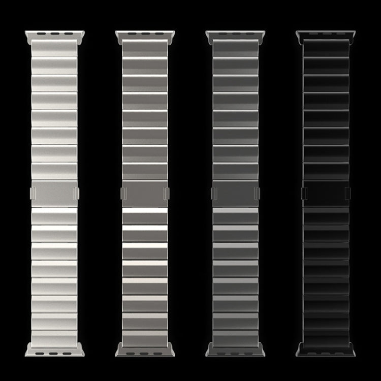 Four titanium metal smartwatch bands in silver, gray, dark gray, and black