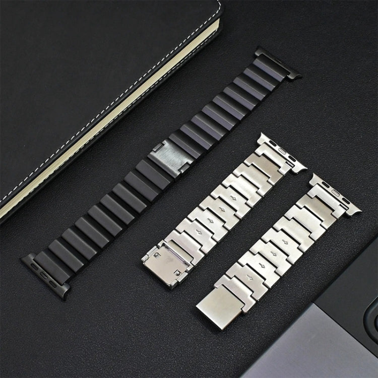 Titanium metal watch bands in black and silver with linked segments and magnetic clasps