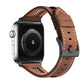 Brown leather Apple Watch band with white stitching, perforations, and mesh inner panels