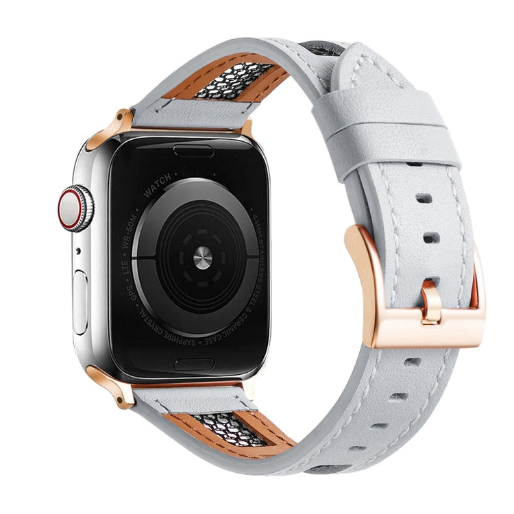 Apple Watch with a light gray perforated leather band and rose gold-tone buckle