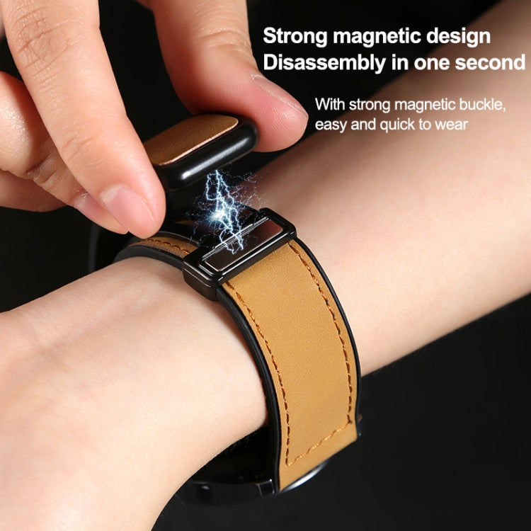 Tan textured watch band with magnetic buckle worn on a wrist