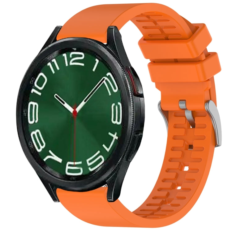 Orange fluororubber watch band fitted to a black smartwatch.