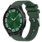 Dark green fluororubber watch band fitted to a black smartwatch.