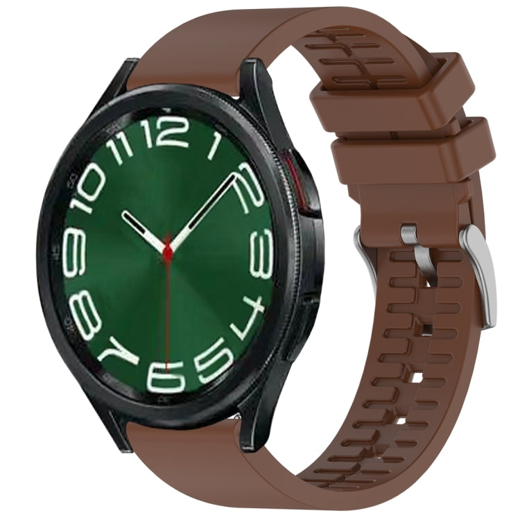 Brown fluororubber watch band fitted to a black smartwatch.