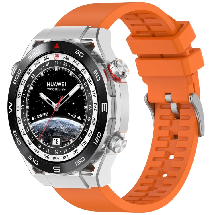 Orange fluororubber watch band shown fitted to a silver smartwatch.
