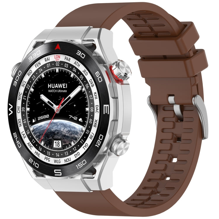 Brown fluororubber watch band fitted to a silver smartwatch.