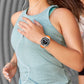 Orange fluororubber watch band worn on the wrist with a smartwatch