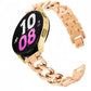 Rose gold metal watch band with interlocking chain links, attached to a round smartwatch.