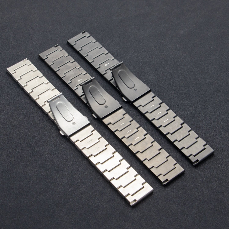 Undersides of three titanium alloy watch bands showing folding clasps