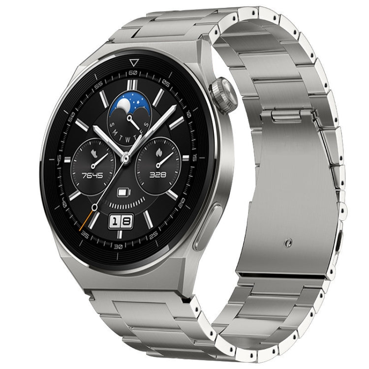 Silver metal link watch band fitted to a smartwatch