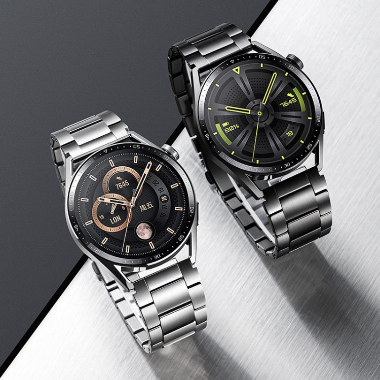 Silver and dark gray metal link watch bands fitted to smartwatches