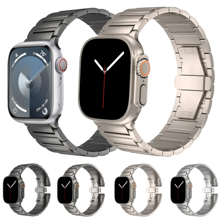 Linked smartwatch bands in black, silver, and light metallic finishes with butterfly clasps