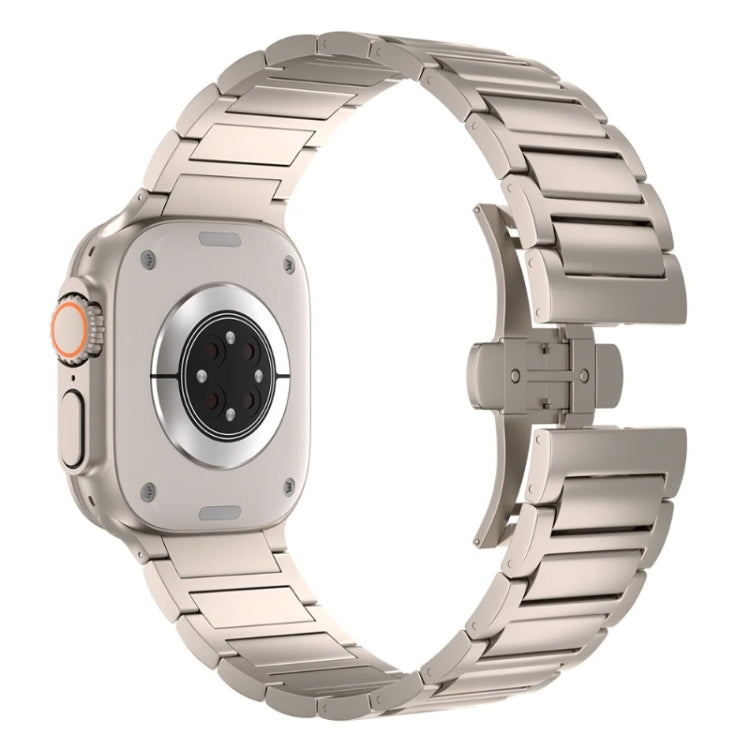 Light metallic linked watch band and butterfly clasp, shown from the back of a smartwatch