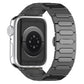 Dark titanium watch band with oval links, attached to a smooth silver watch case back