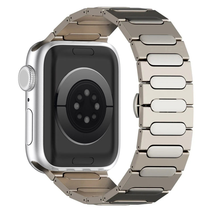Light oval-link titanium watch band attached to a silver watch case