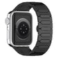 Black titanium alloy Apple Watch band with linked oval plates, shown attached to a silver watch.