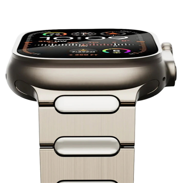 Close-up of titanium watch band with brushed oval links attached to a watch