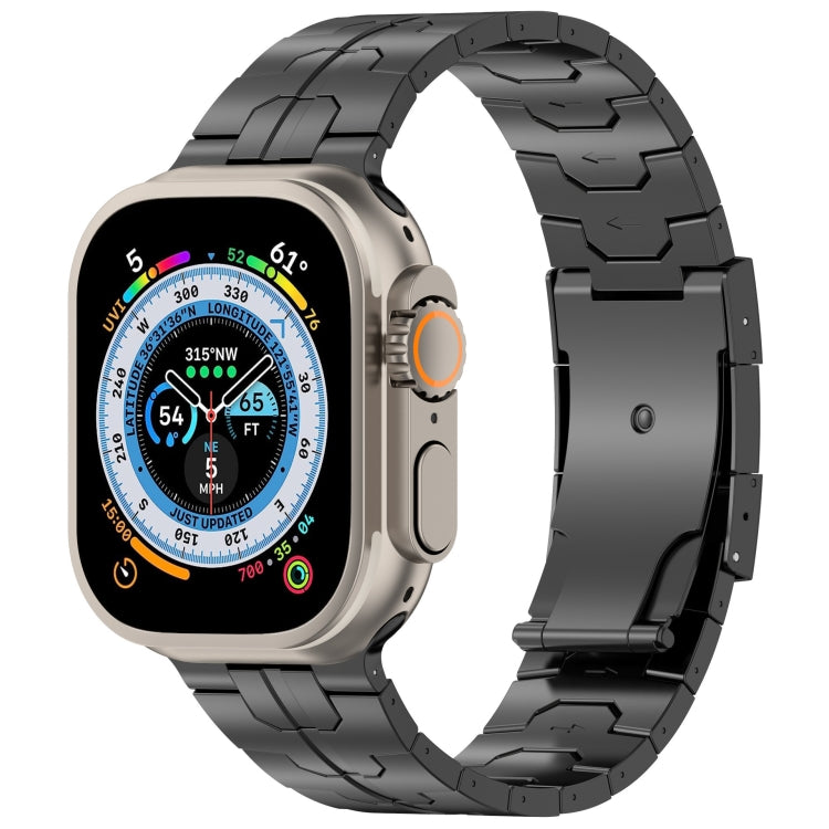 Black linked metal Apple Watch band with turtle buckle, paired with a compass-face watch