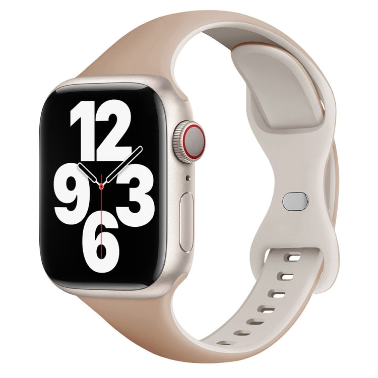 Slim pale beige silicone watch band with butterfly buckle, shown on a smartwatch
