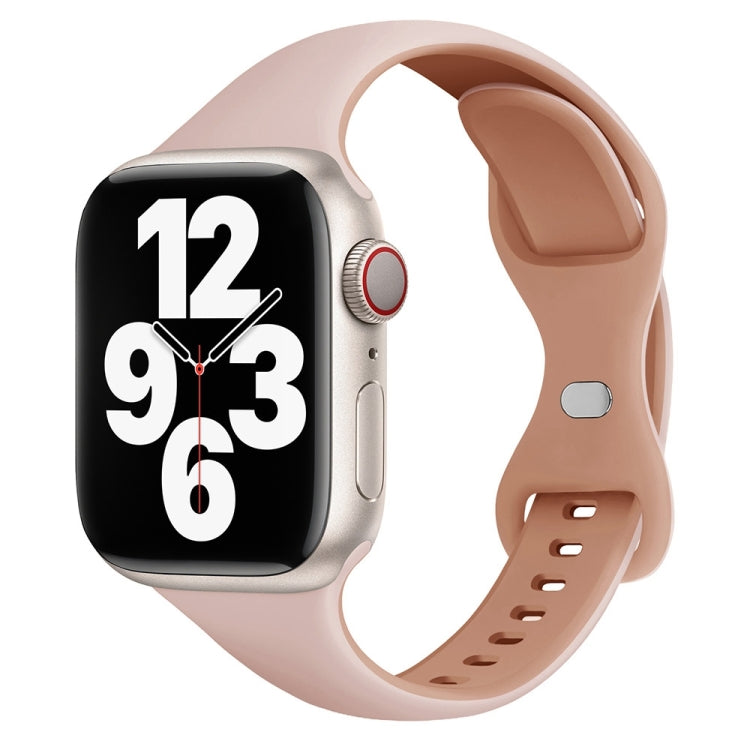 Slim pink and rose-gray silicone watch band with butterfly buckle on a smartwatch
