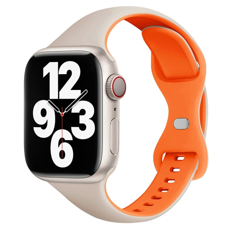 Slim light-colored and orange silicone watch band with butterfly buckle on a smartwatch