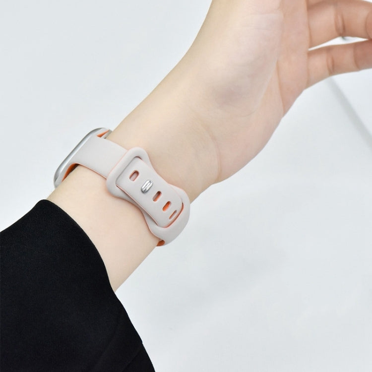 Light silicone watch band with double buckle fastened around a wrist