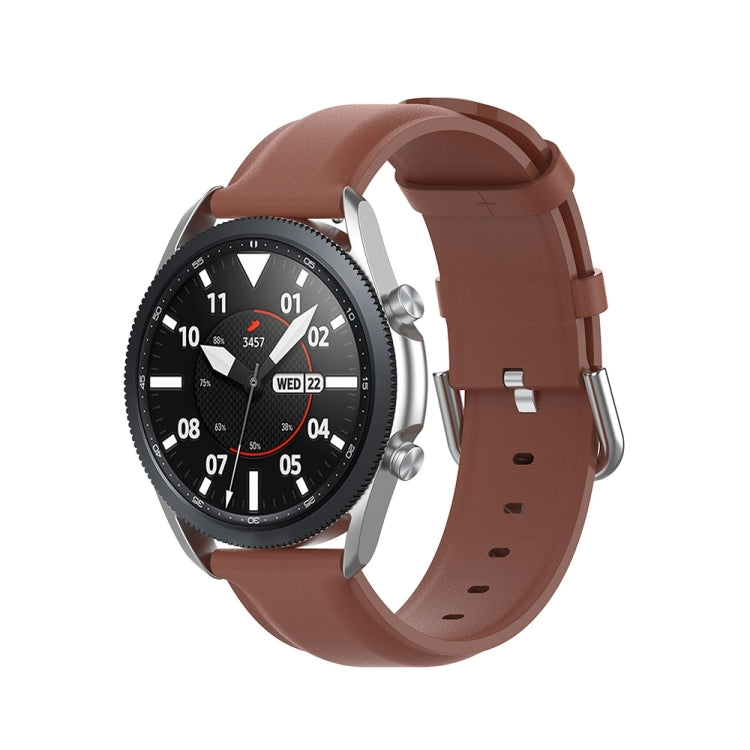 Brown leather watch strap with metal buckle and adjustment holes