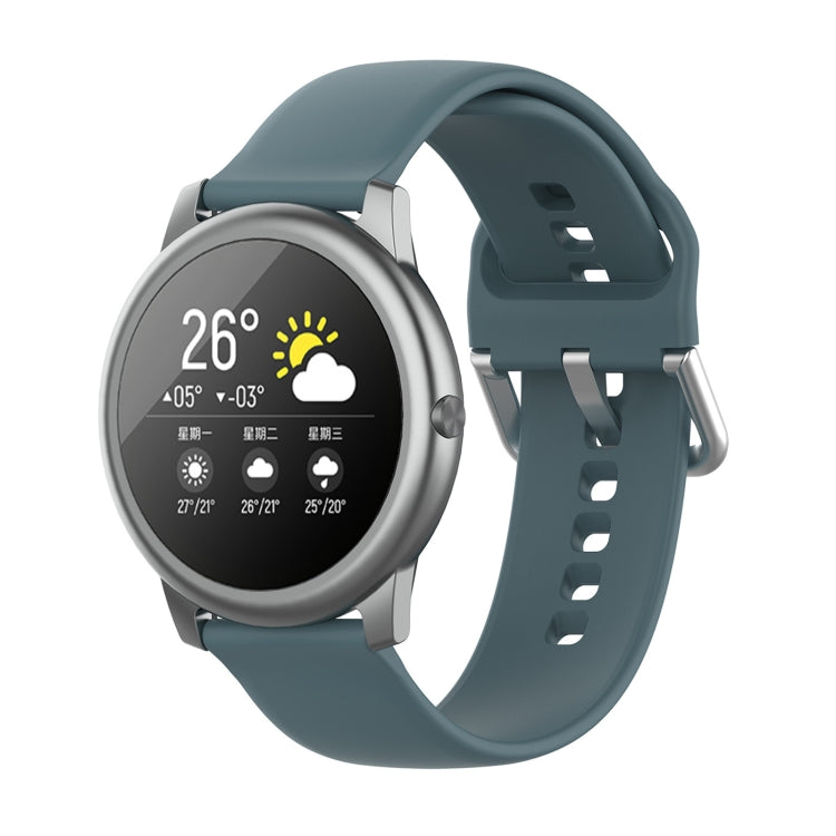 Teal silicone watch strap with metal buckle and silver watch case