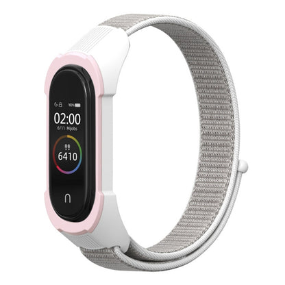 Pink and white nylon watch strap with gray woven band and smartwatch display