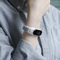 Gray and pink nylon smartwatch strap on wrist, watch face visible