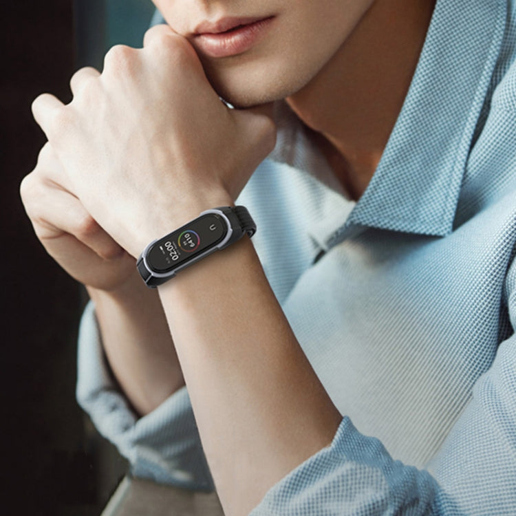 Black nylon smartwatch strap on wrist with watch display visible