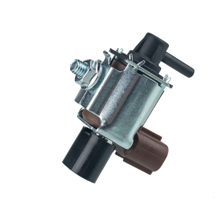 Auto vacuum solenoid valve angled view, silver housing with brown plastic connector
