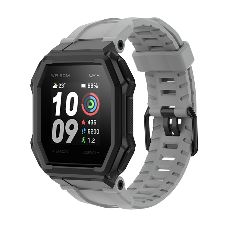 Light gray silicone watch strap with perforated links and secure buckle