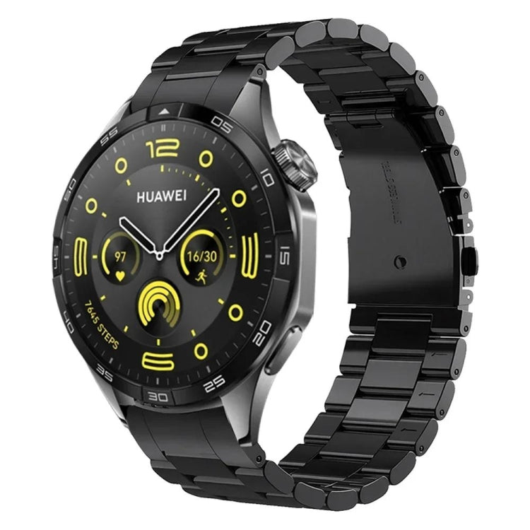 Black stainless steel watch band with curved links, shown attached to a Huawei watch.