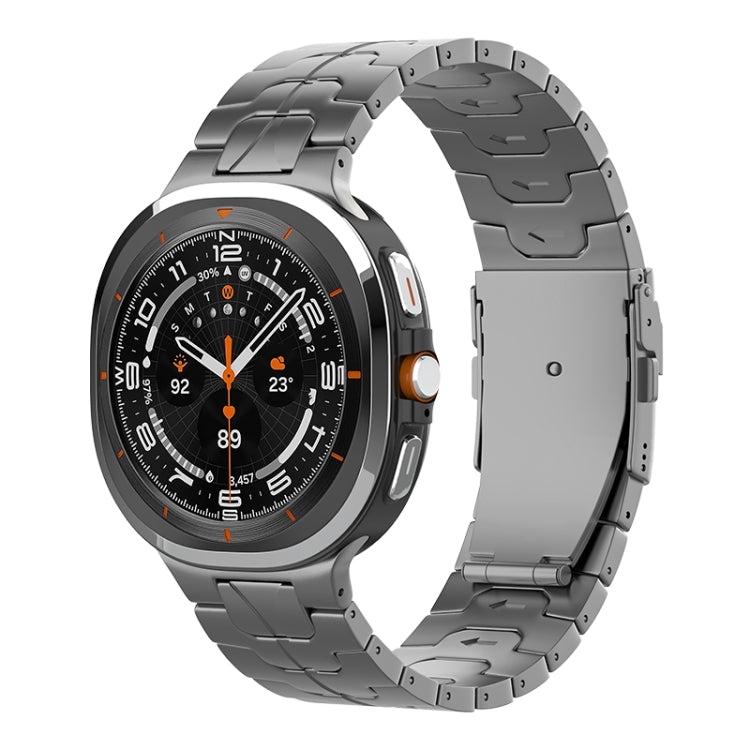 Dark gray titanium link watch band with a folding safety clasp, shown attached to a watch.