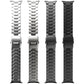 Four titanium link watch bands in silver, gray, and black, each with a safety clasp.