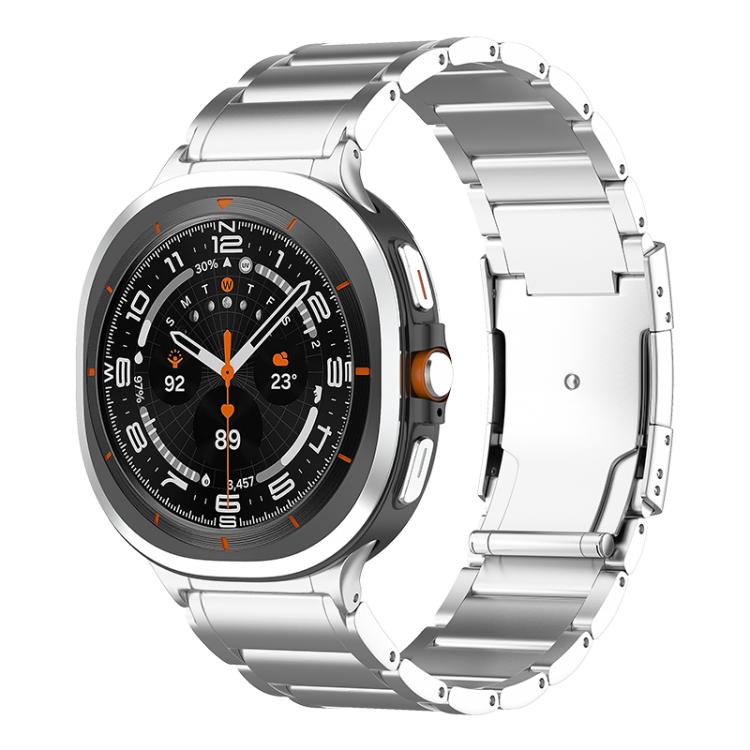 Silver metal watch band with a Galaxy smartwatch and a wide folding clasp.