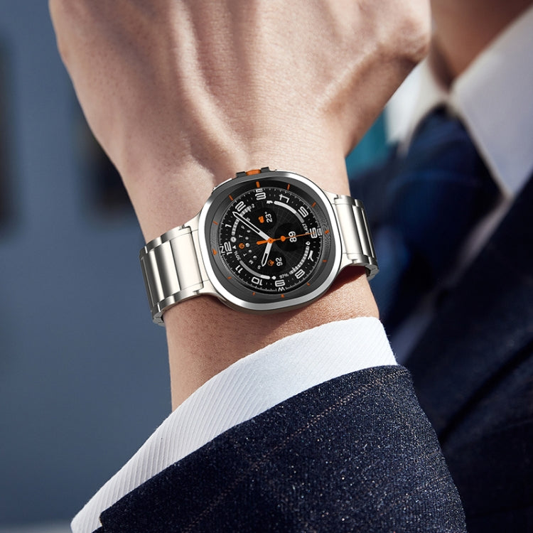 Silver titanium steel watch band with three-bead links, worn with a Galaxy smartwatch