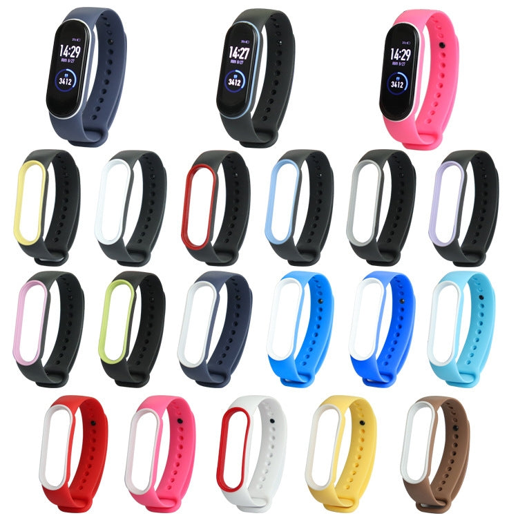 Multiple two-tone TPE replacement smartwatch straps for Mi Band 5 in mixed colors.