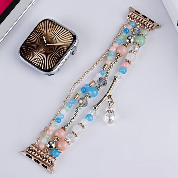 Multicolor beaded Apple Watch band with copper-tone chain strands and a crystal charm