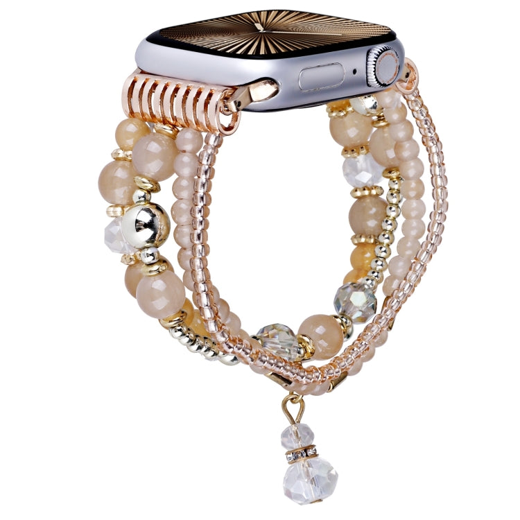 Apricot beaded Apple Watch band with rose-gold chain strands and dangling crystal charm