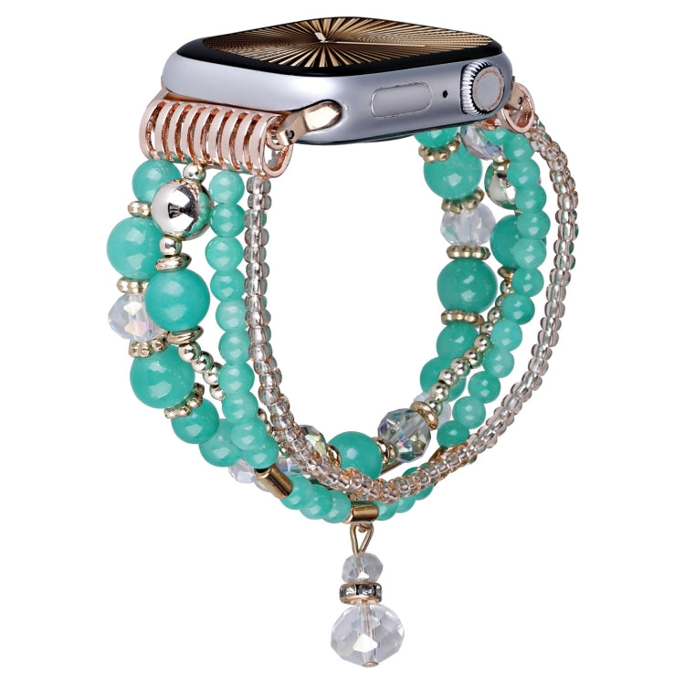 Turquoise beaded Apple Watch band with chain strands and dangling crystal charm