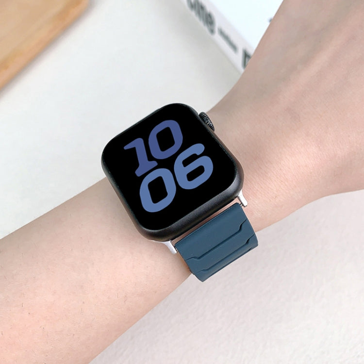 Dark blue silicone watch band shown on a wrist