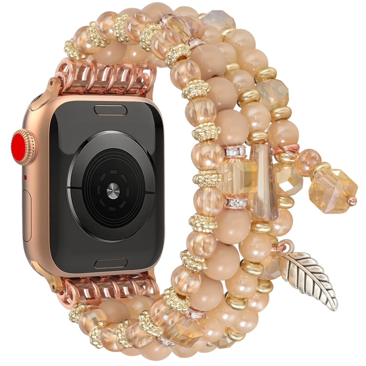 Beaded Apple Watch band shown from the back, with peach beads and gold accents