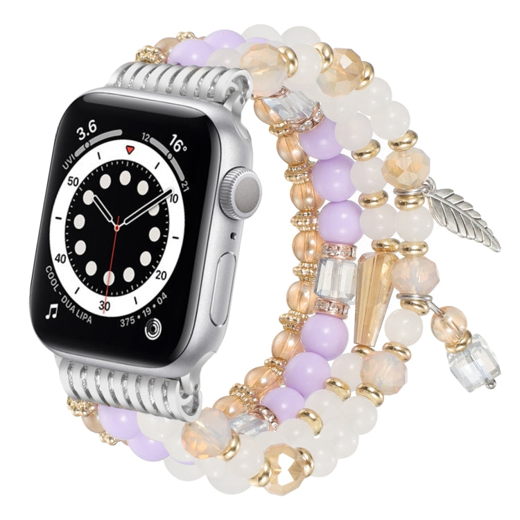 Apple Watch band with lavender and white beads, gold accents, and a silver watch case